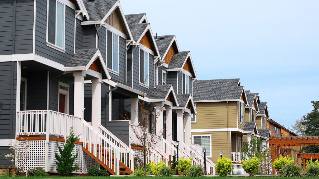 A row of modern multifamily residential buildings showcasing attached homes in a well-maintained community, representing the scale and appeal of multifamily real estate. The image symbolizes multifamily investing, residential rental communities, income-producing properties, commercial real estate, portfolio diversification, passive real estate investing, property ownership, long-term wealth creation, recurring rental income, and why multifamily real estate is a foundational asset class for investors seeking stable cash flow and long-term appreciation. A row of modern multifamily residential buildings showcasing attached homes in a well-maintained community, representing the scale and appeal of multifamily real estate. The image symbolizes multifamily investing, residential rental communities, income-producing properties, commercial real estate, portfolio diversification, passive real estate investing, property ownership, long-term wealth creation, recurring rental income, and why multifamily real estate is a foundational asset class for investors seeking stable cash flow and long-term appreciation.
