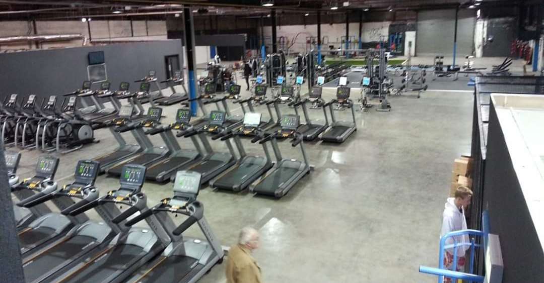 Cardio equipment area within a completed FLYEfit gym