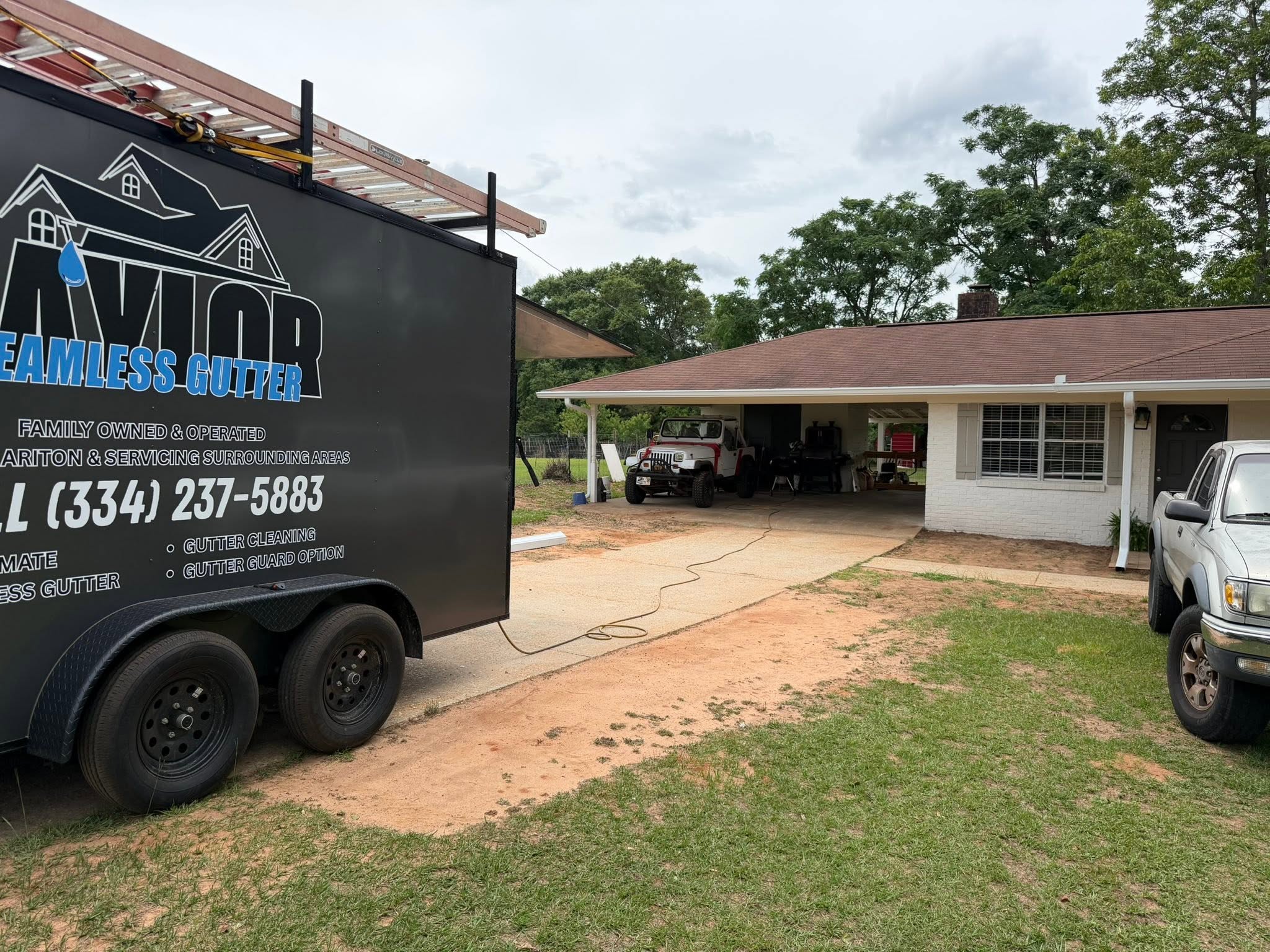 Taylor Seamless Gutters family completing a residential gutter project