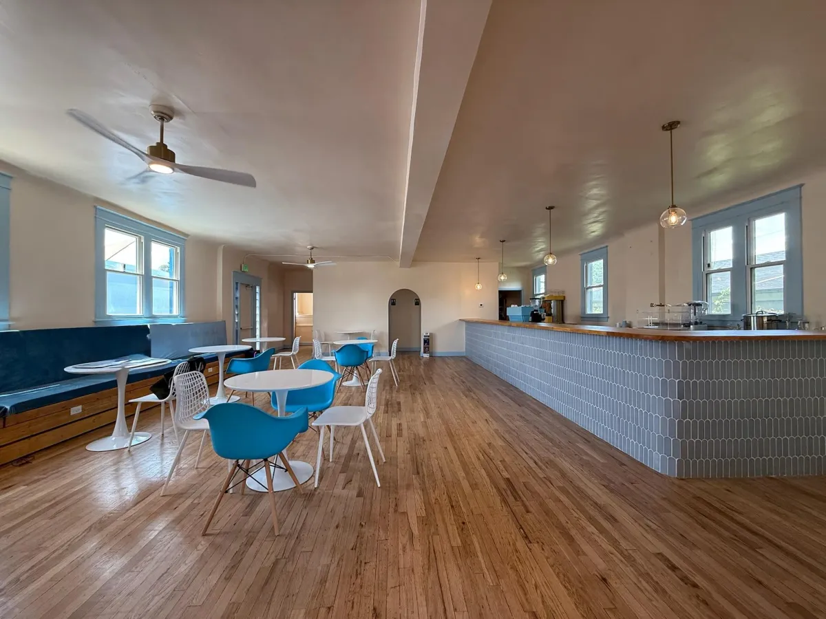 The Vivid Minds Cafe seating area and counter at 1545 S Broadway