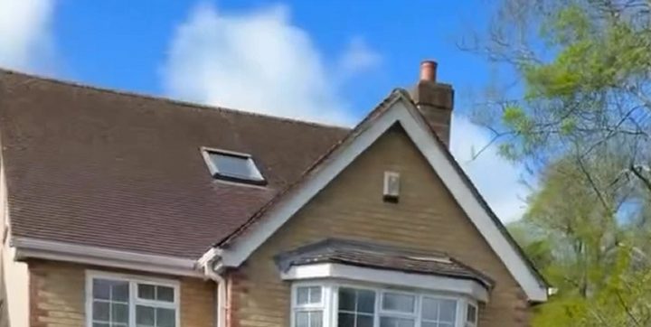Before: a tiled house roof, dark and dull, with a skylight and a front gable