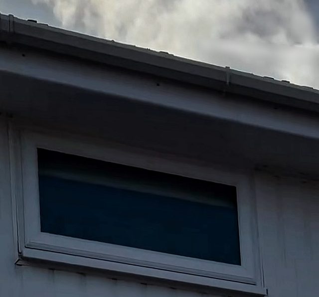 After: the same gutter and soffit, with the black streaks gone
