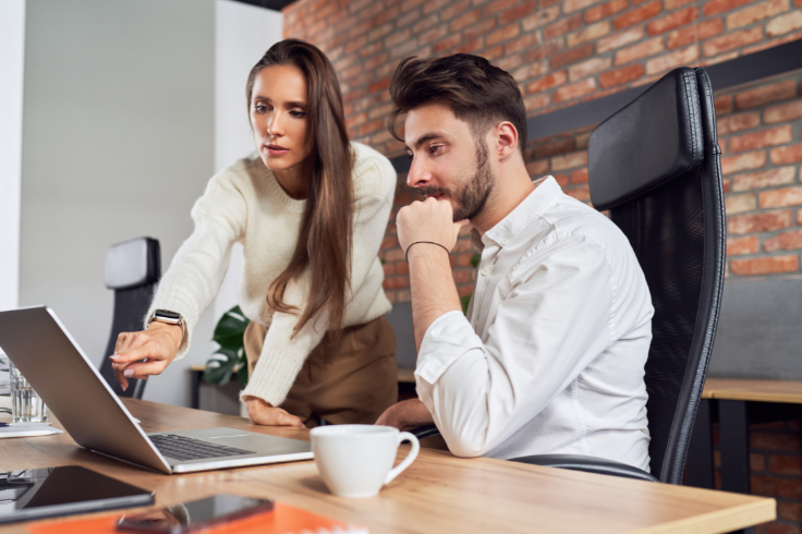 Two brand marketers discussing client onboarding practices
