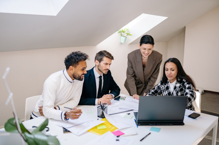 A group of four colleagues implementing new offers