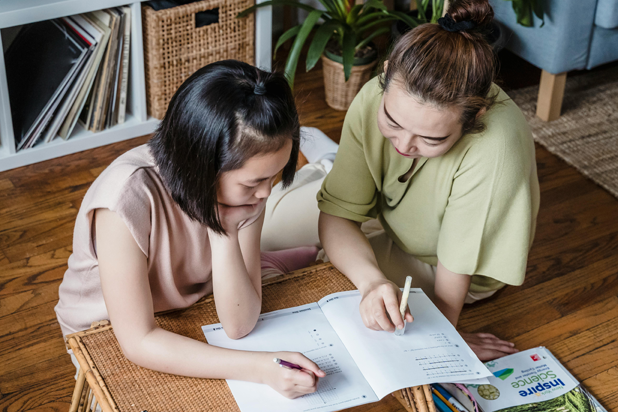 Two businesswomen talking outside modern building