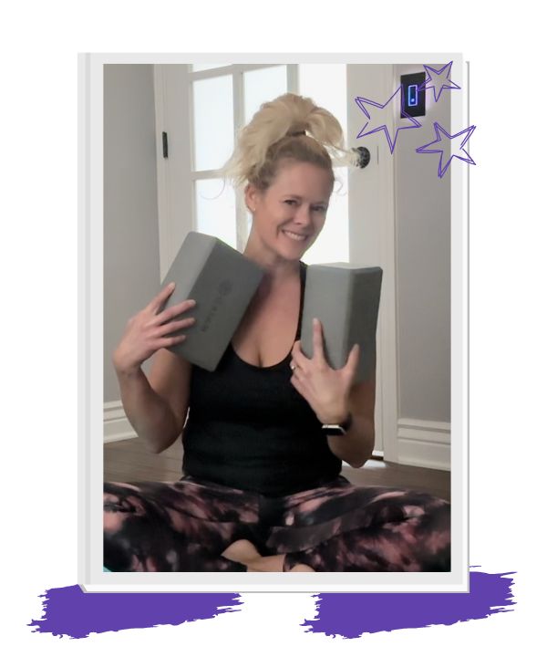 yoga instructor, Jennifer, sitting in easy seat with yoga blocks