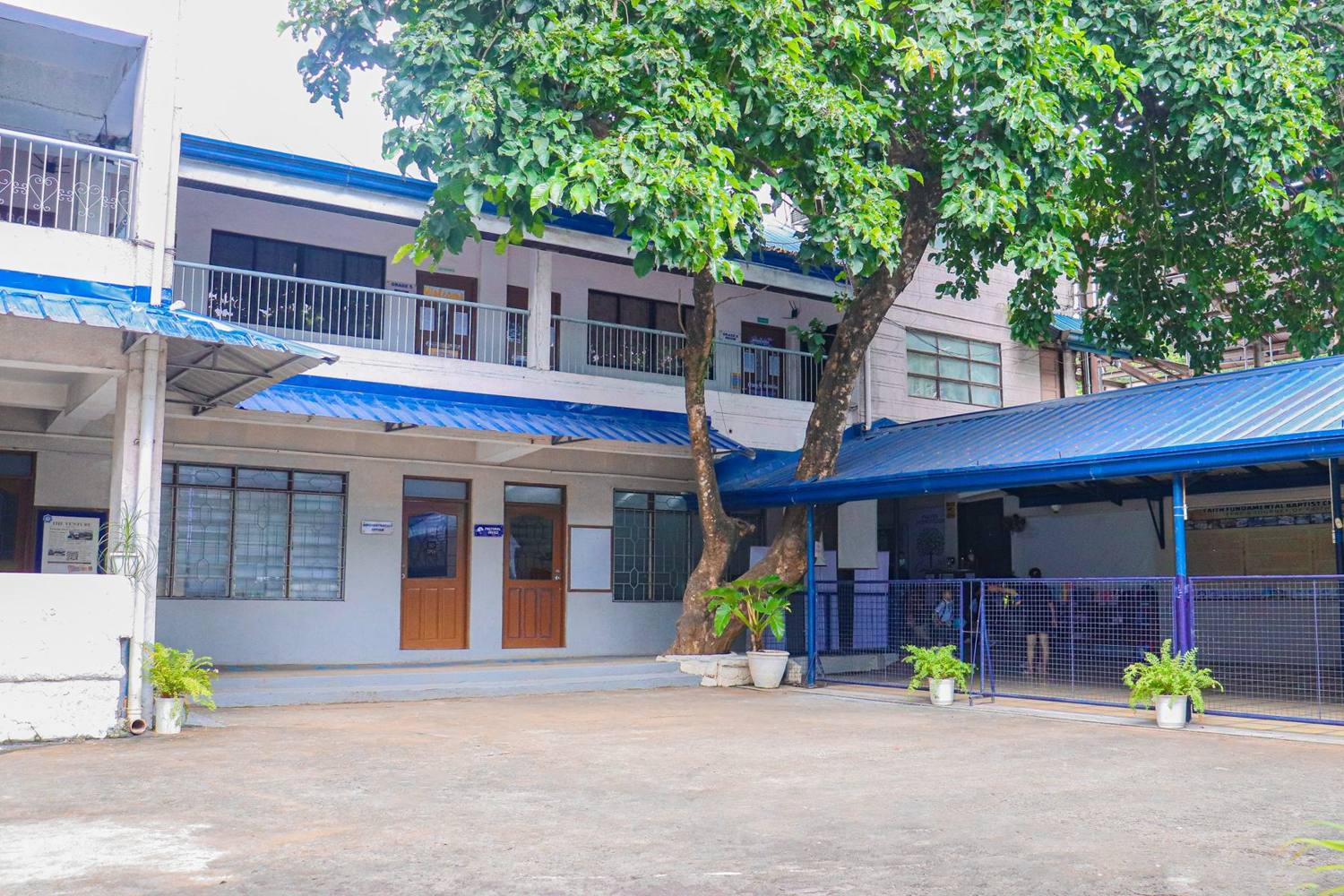 The AFCS courtyard and school buildings
