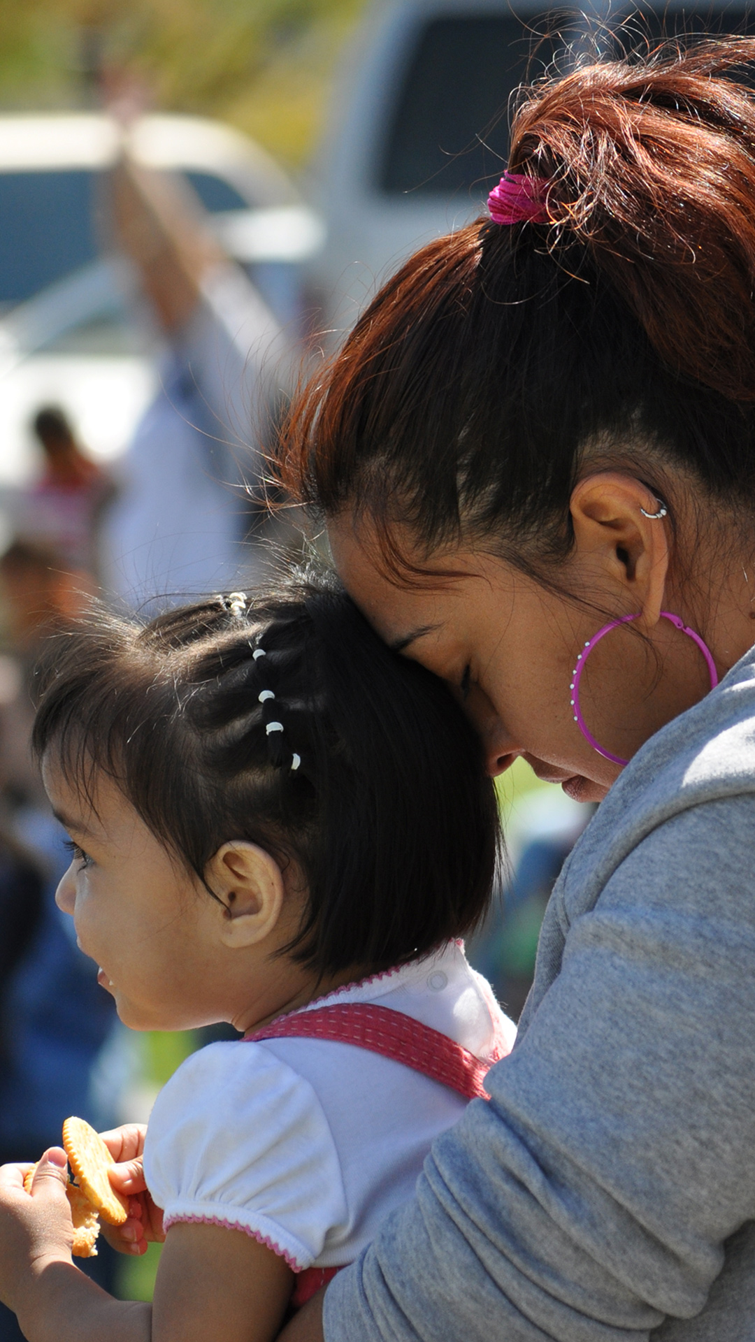 A mother and child praying together