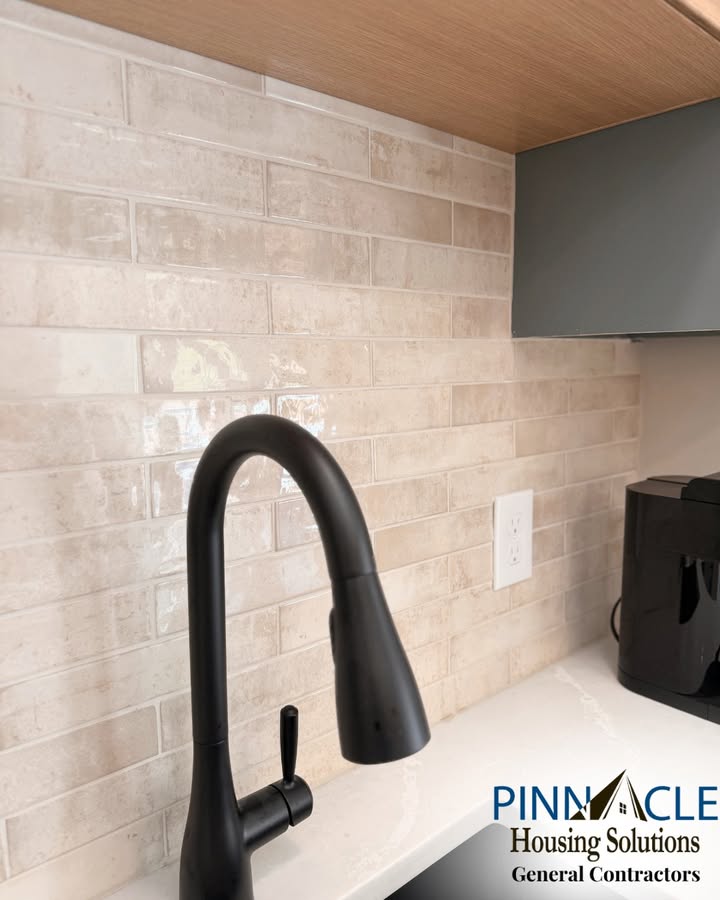 Close-up of the tile backsplash and matte black faucet at a basement bar remodel in Chester County, PA.