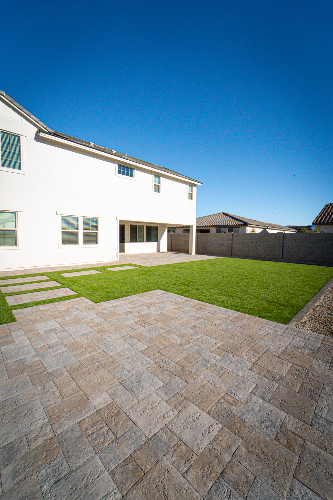 Patio Cover, Paver Walkways and Turf Covered Backyard