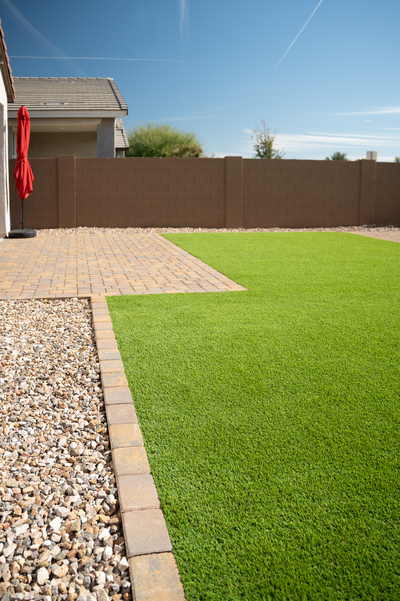Gravel, Paver Border, Custom Paver Back Patio and Turf