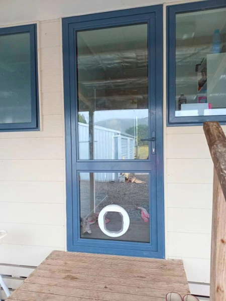 Modern glass surrounds for entryway door in Martinborough property