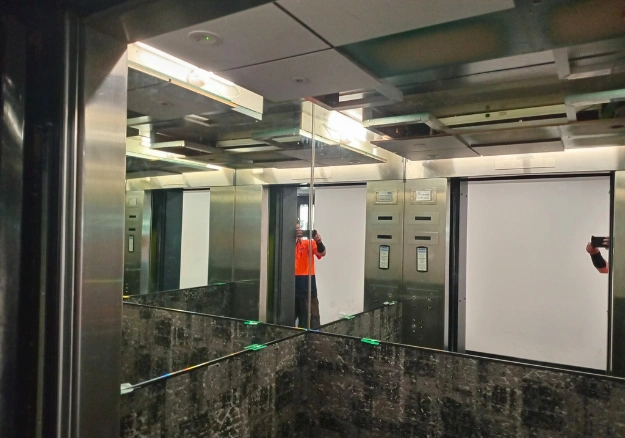 Elevator glass mirror installation in Wellinton