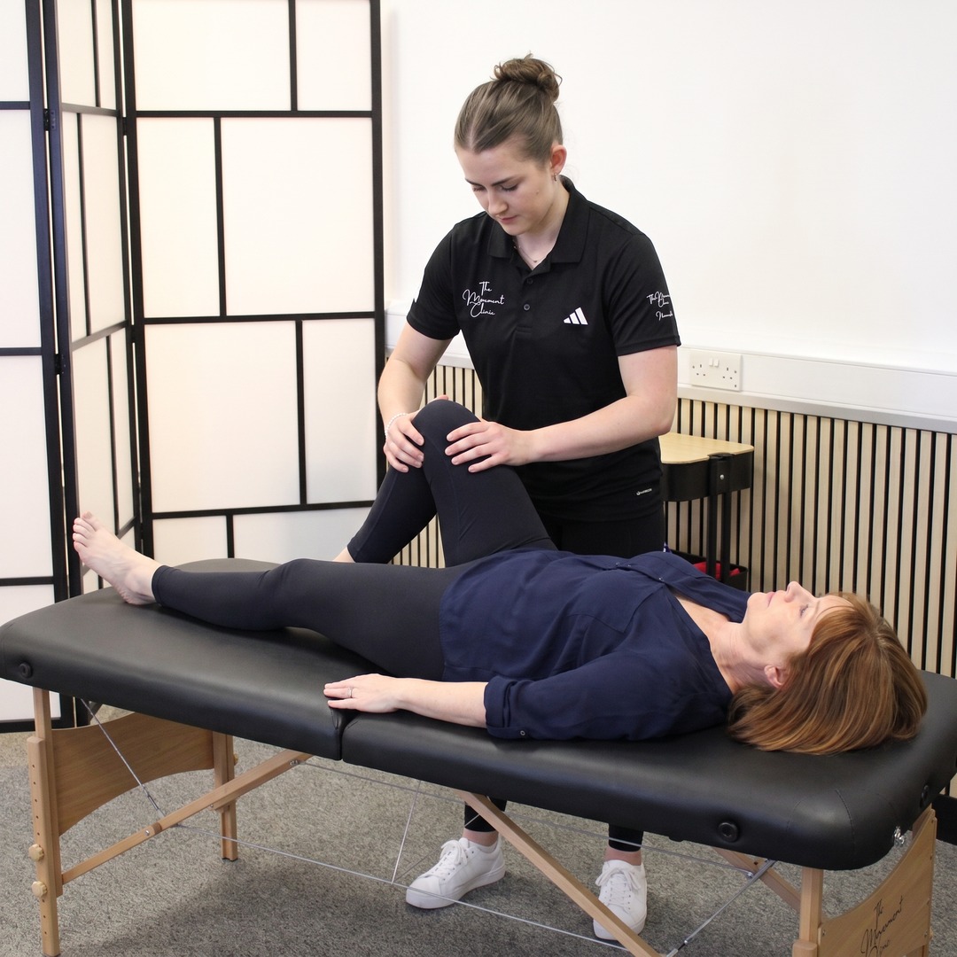 Hands-on knee treatment at The Movement Clinic