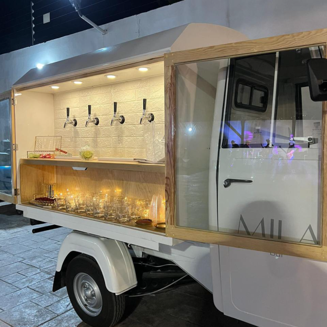 Piaggio Apé Mobile Bar cart with taps ready for guests