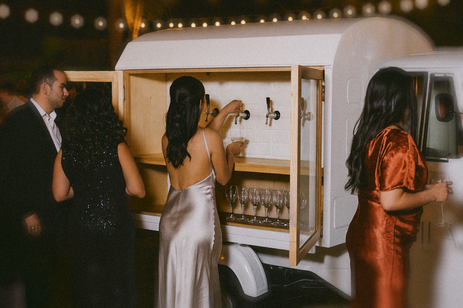 Guests gathered around Mila Bar at a celebration