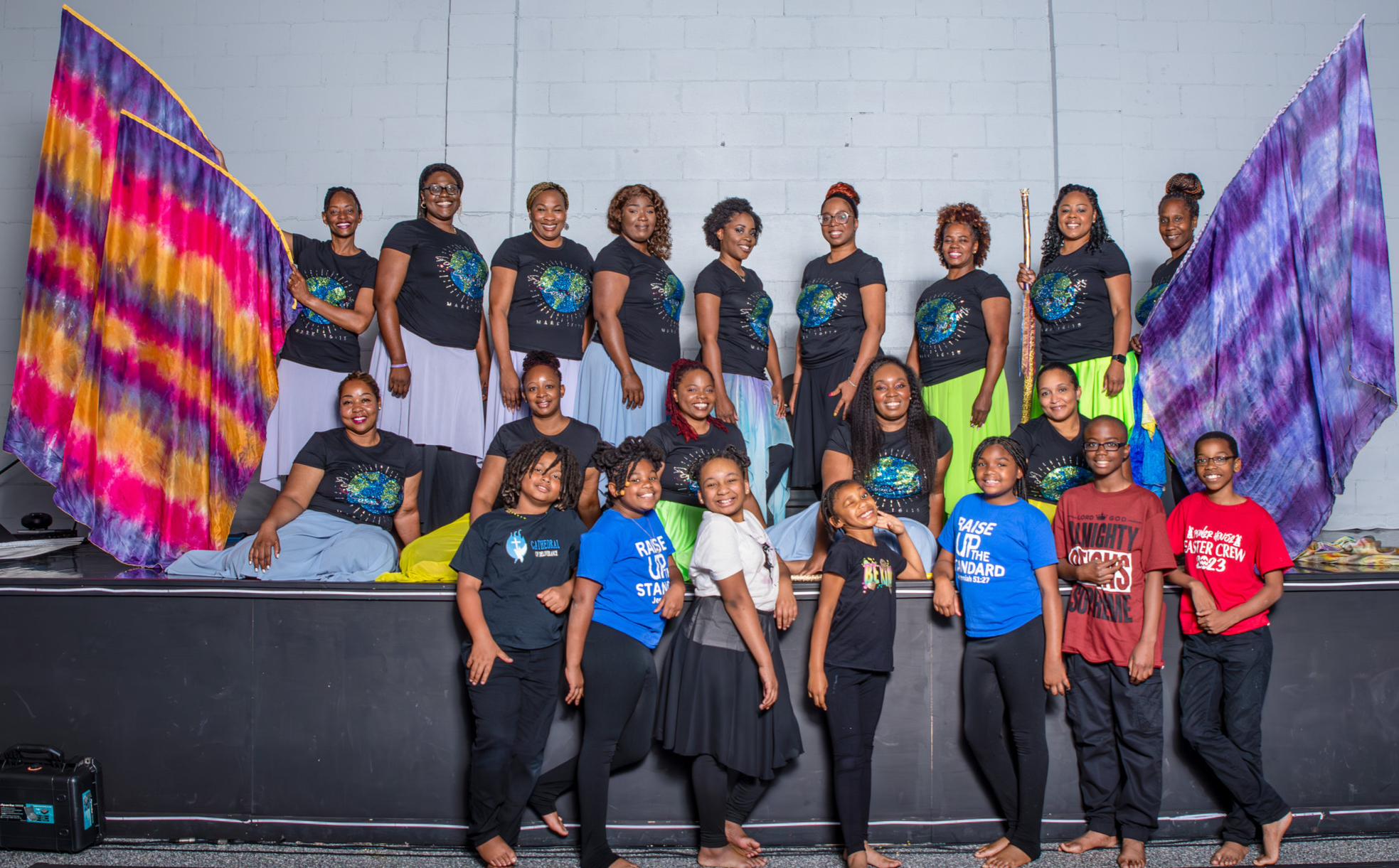 Beautiful Feet youth and company dancers gathered together with colorful worship flags