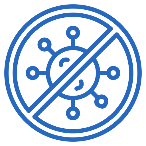 A man in a yellow cap and white shirt assembling furniture on the floor, holding a wrench.