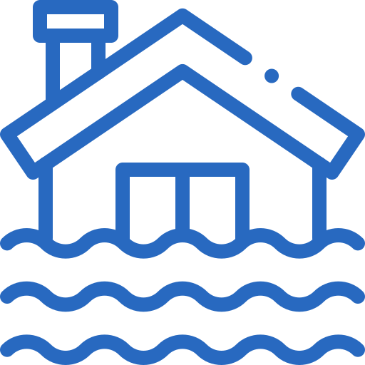 A man in a yellow cap and white shirt assembling furniture on the floor, holding a wrench.