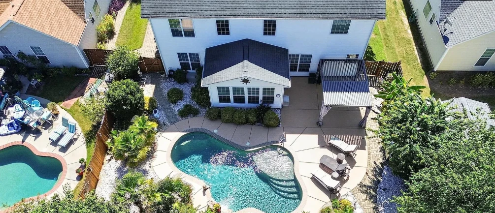 Aerial view of home and pool