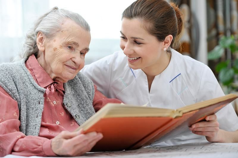 A caregiver sharing a warm moment with a resident