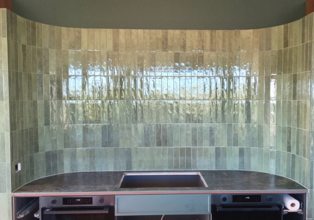 Kitchen splashback tiled with handmade ceramic tiles in Bay of Islands