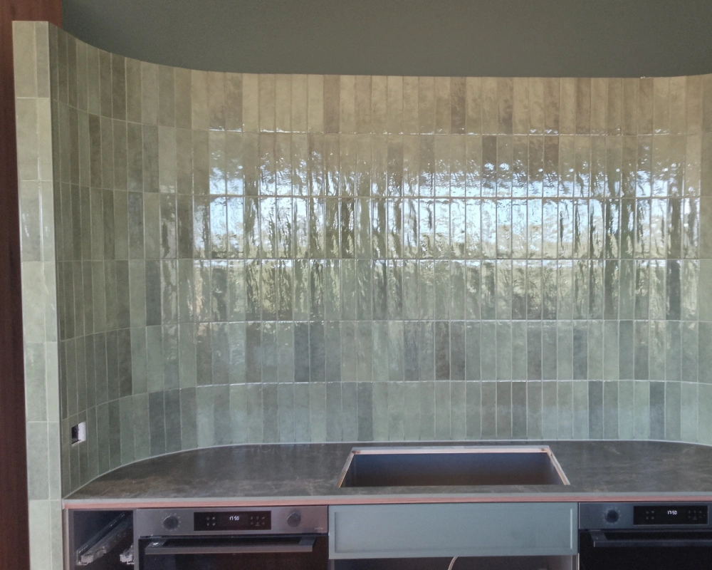 Kitchen splashback tiled with handmade ceramic tiles in Bay of Islands