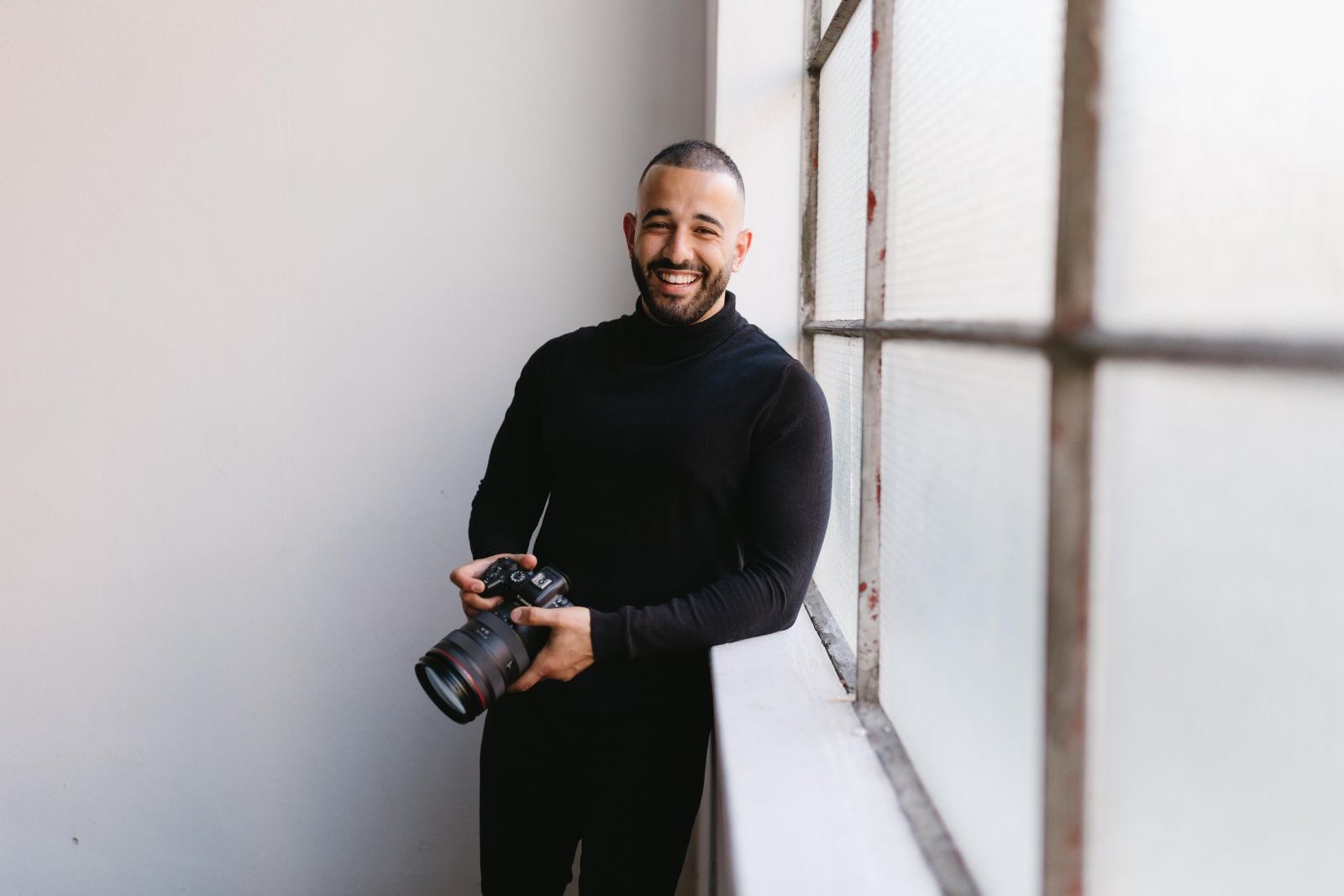 Andro Bottros, director of Rêverie Weddings, holding his camera