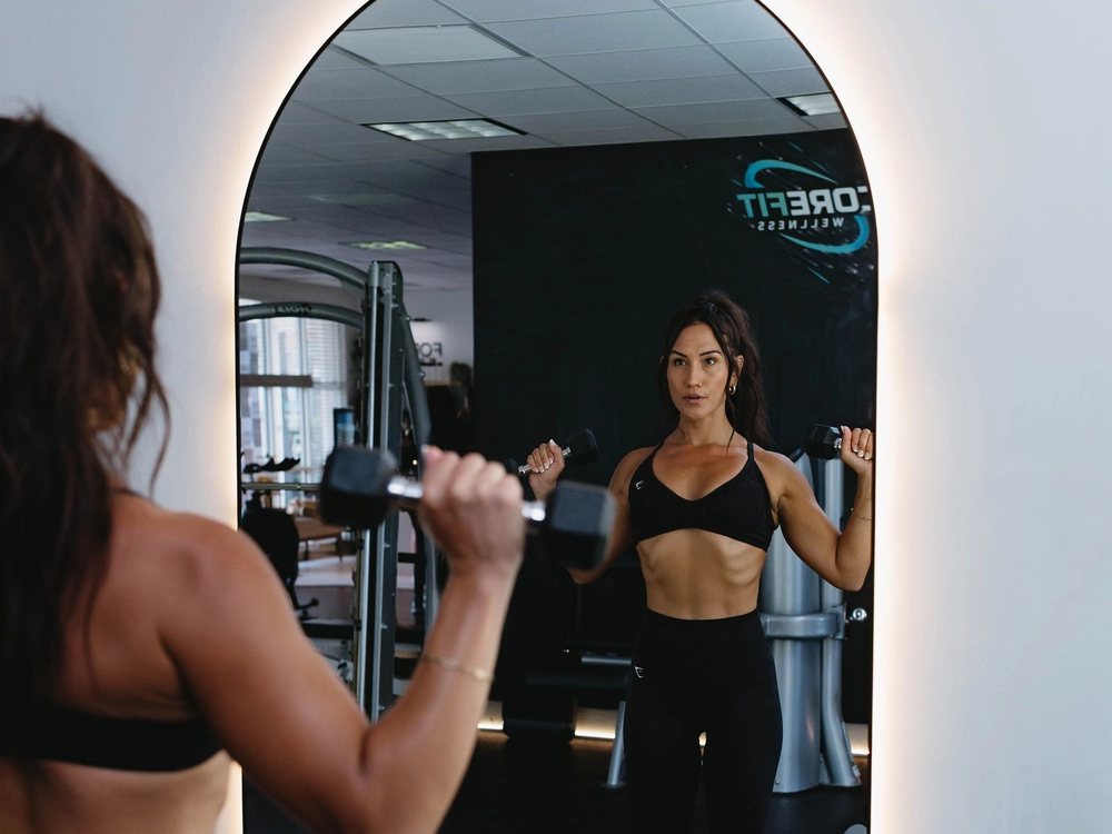 A FORM by CoreFit member training in the studio mirror