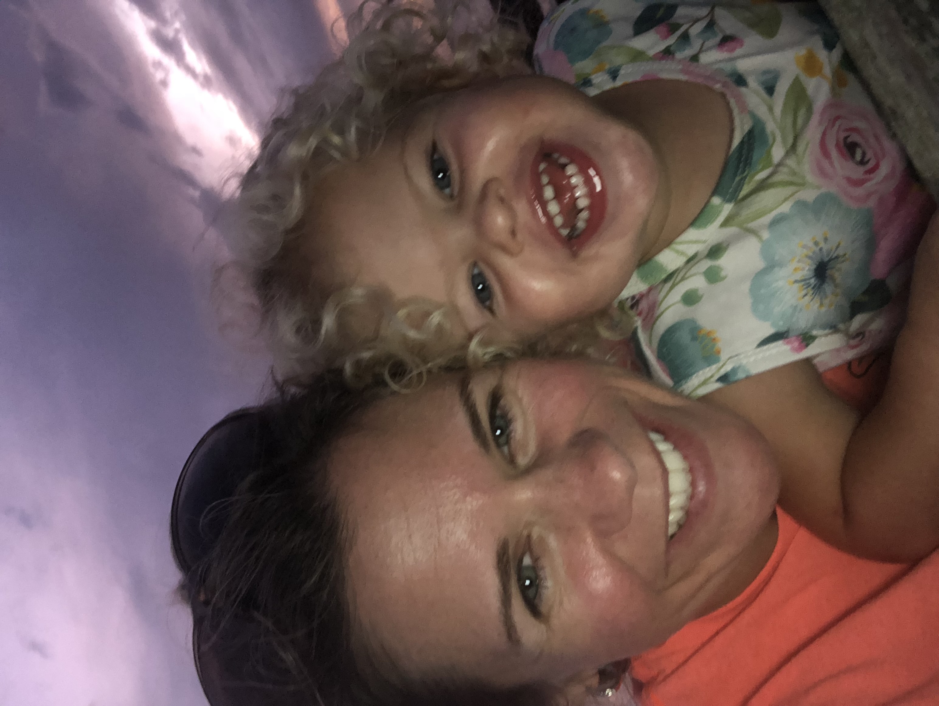 Coach and a toddler smiling together