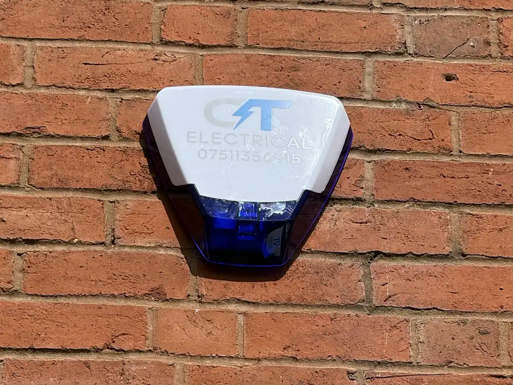 CT Electrical branded intruder alarm bell box installed on a house in the West Midlands