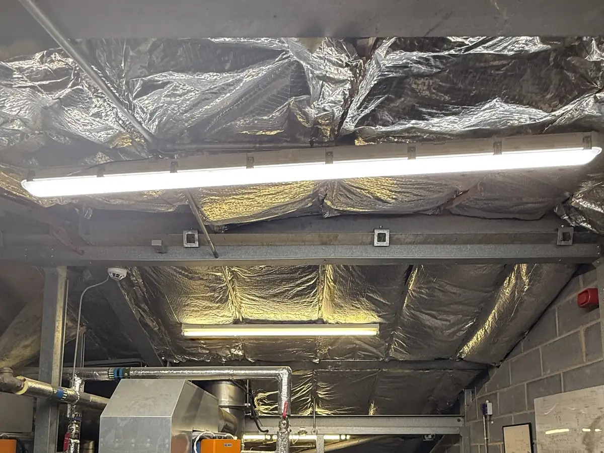New LED batten lighting installed in a commercial plant room by CT Electrical