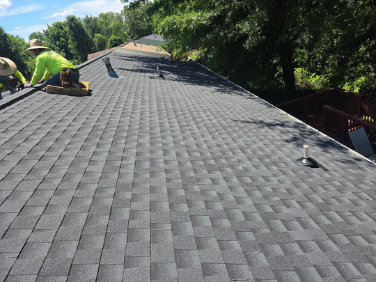 Knock on Wood Roofing crew performing a residential roof inspection