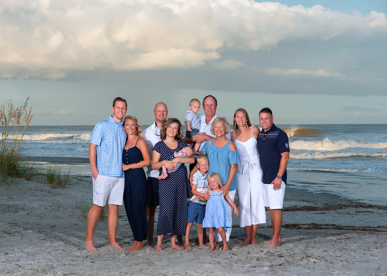 Extended family portrait on Hilton Head beach during a multigenerational photo session at sunset on North Forest Beach.