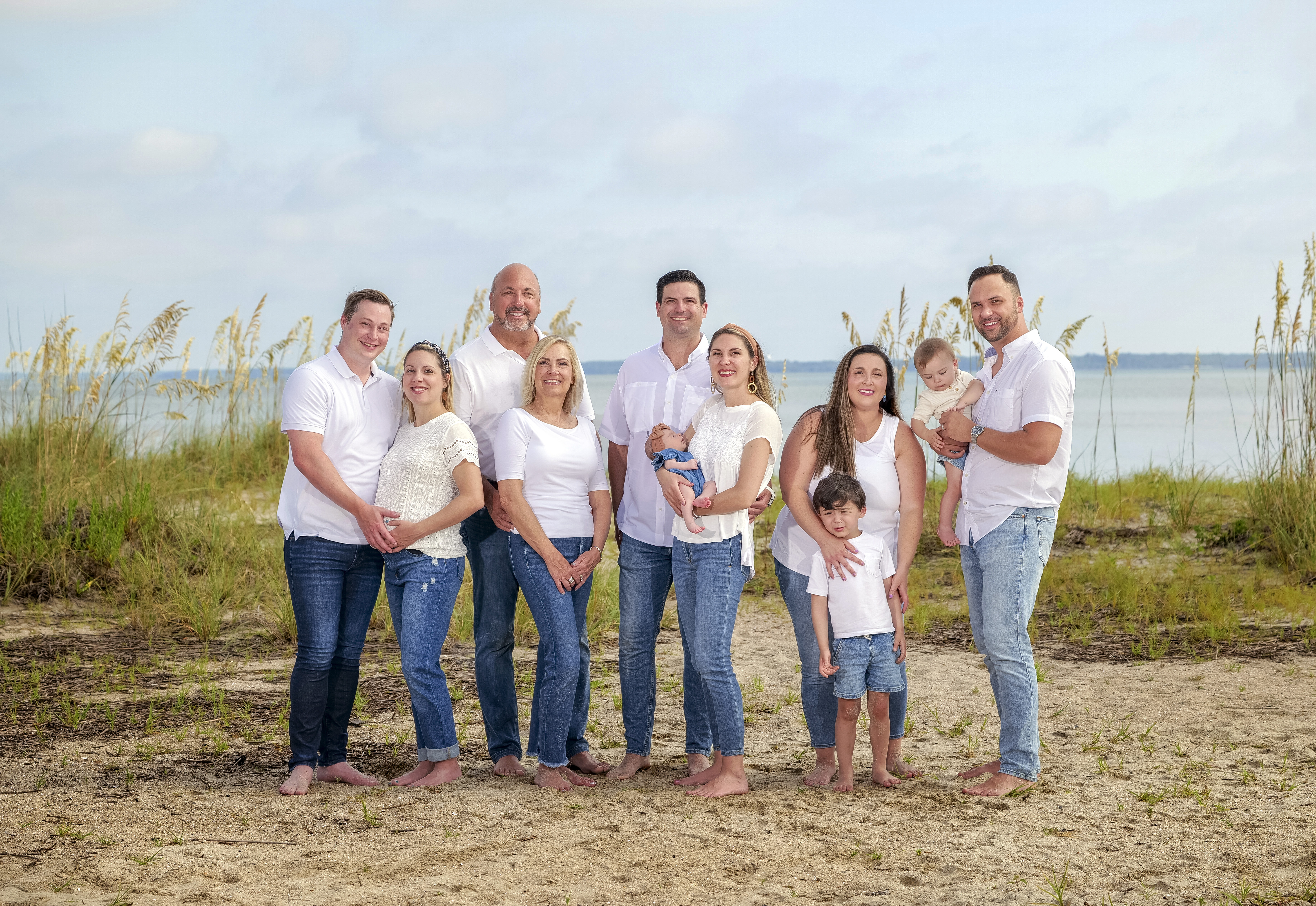 Large extended family posing on Hilton Head beach during Signature beach photography session