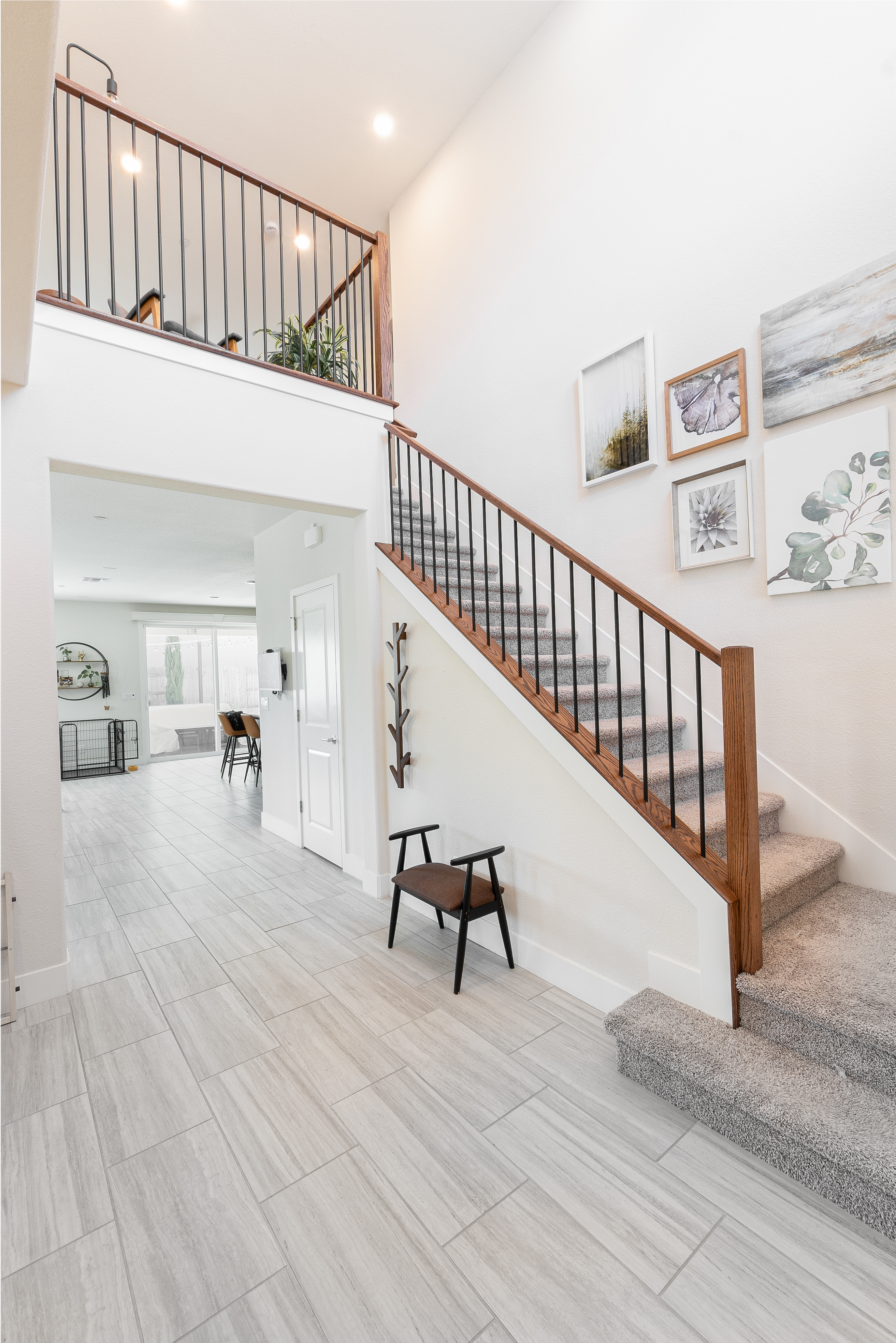 Open iron baluster railing overlooking living room after pony wall removal, Roseville CA