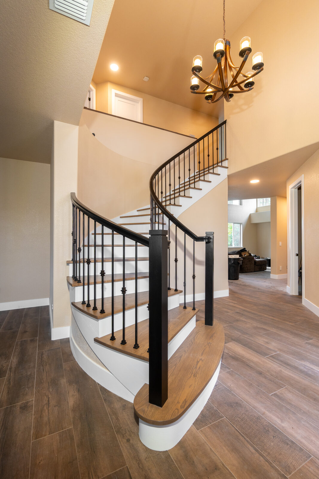 Curved staircase with hardwood treads and updated railing, Roseville CA