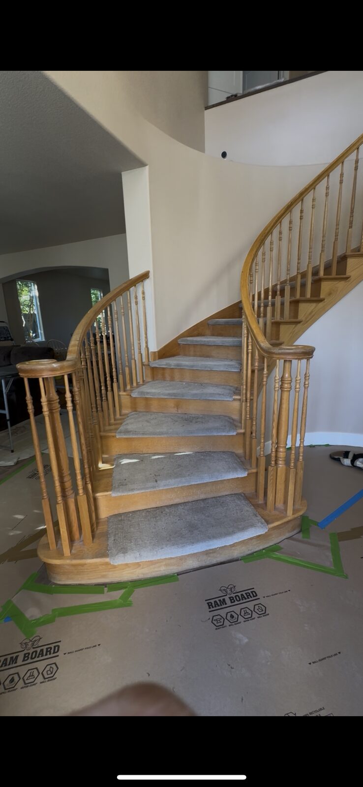 Curved staircase with carpet and white spindles before remodel, Roseville CA