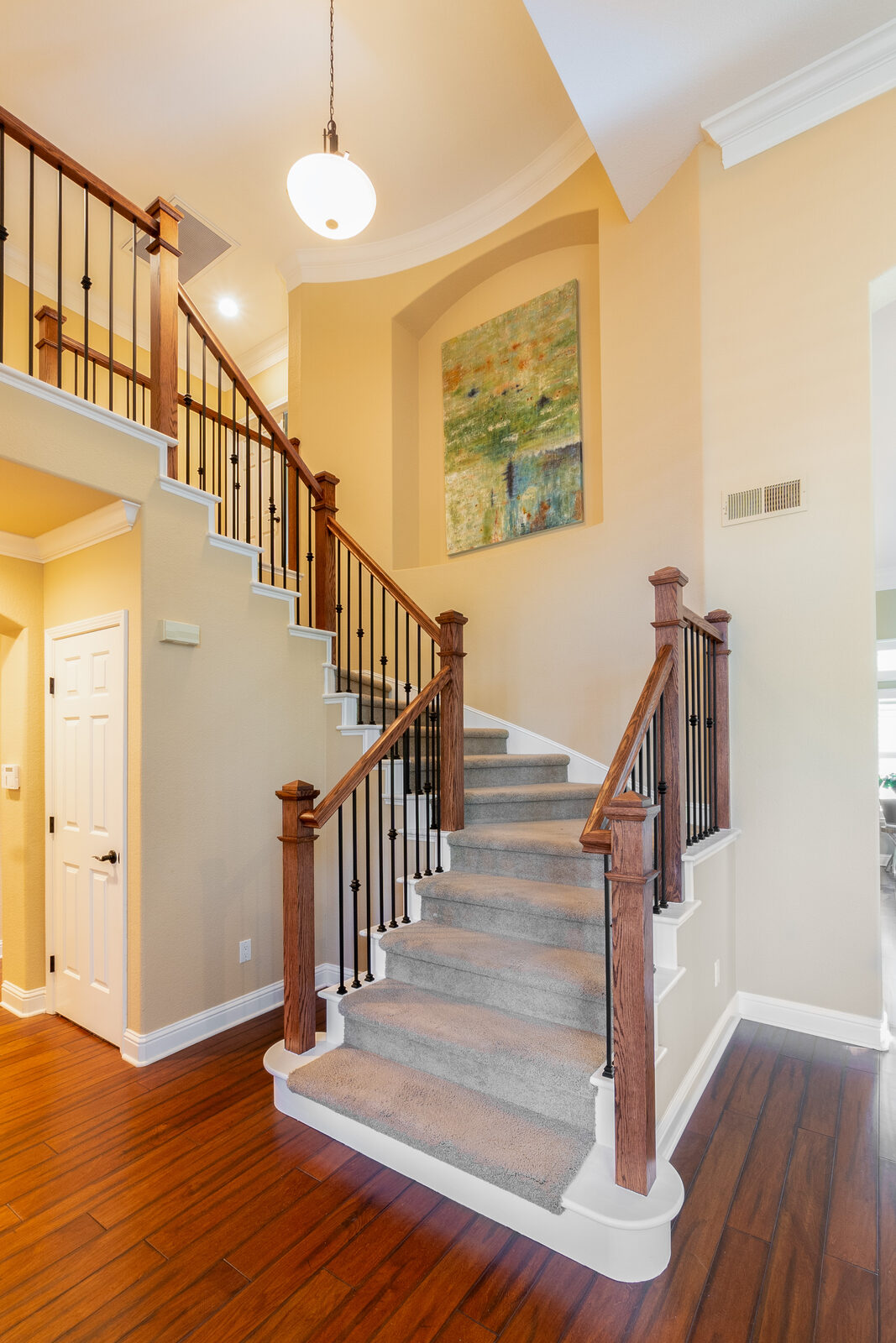 Wrought iron baluster railing upgrade with stained handrail, Roseville CA
