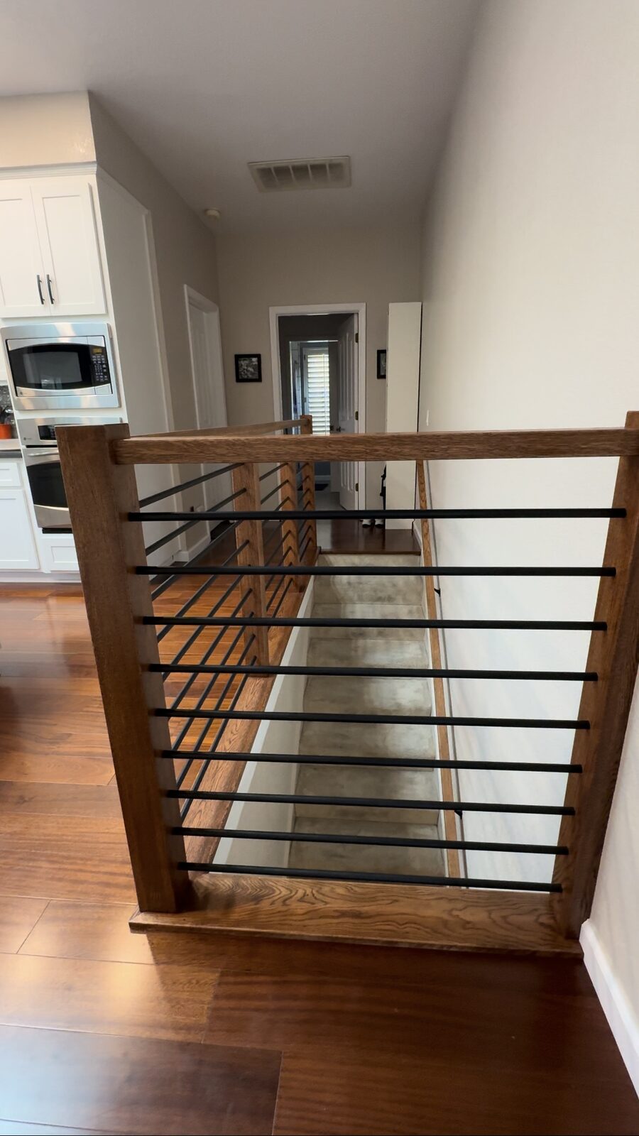 Open landing with modern horizontal iron railing, Roseville CA