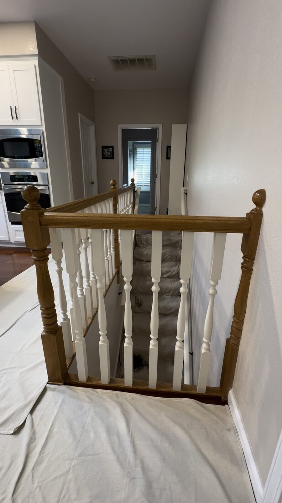 Open landing with dated wood railing before remodel, Roseville CA