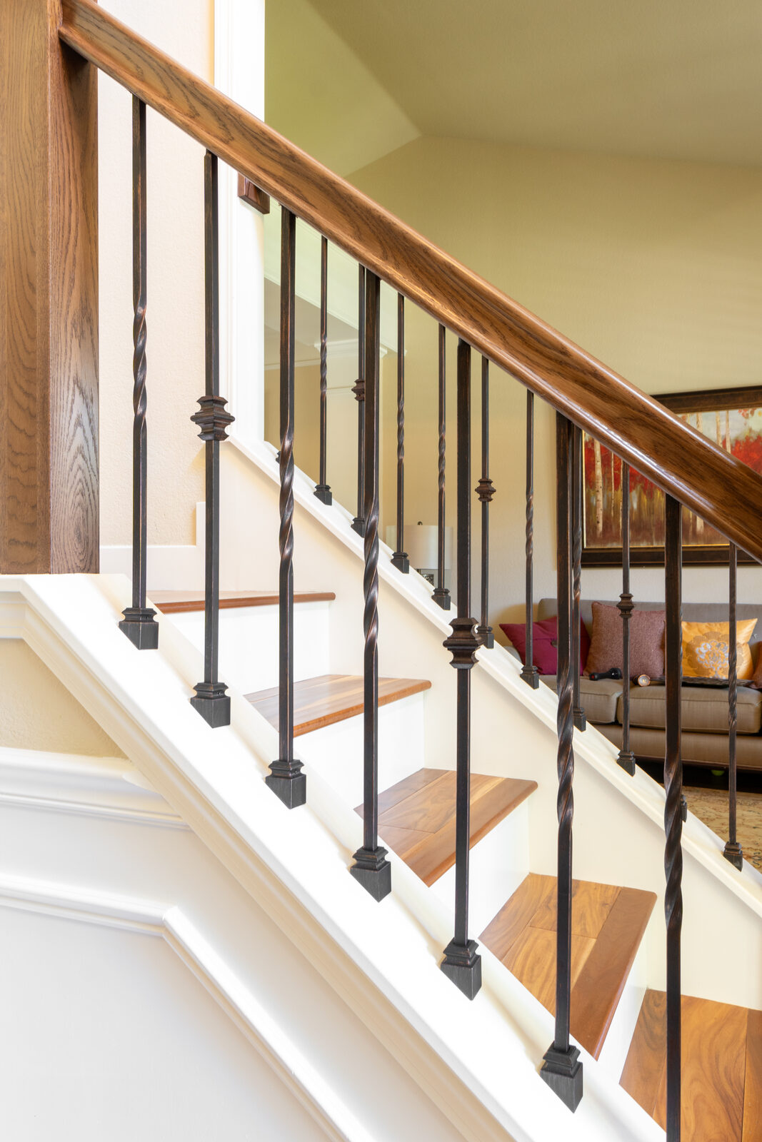 Dark iron baluster staircase with hardwood treads, Granite Bay CA