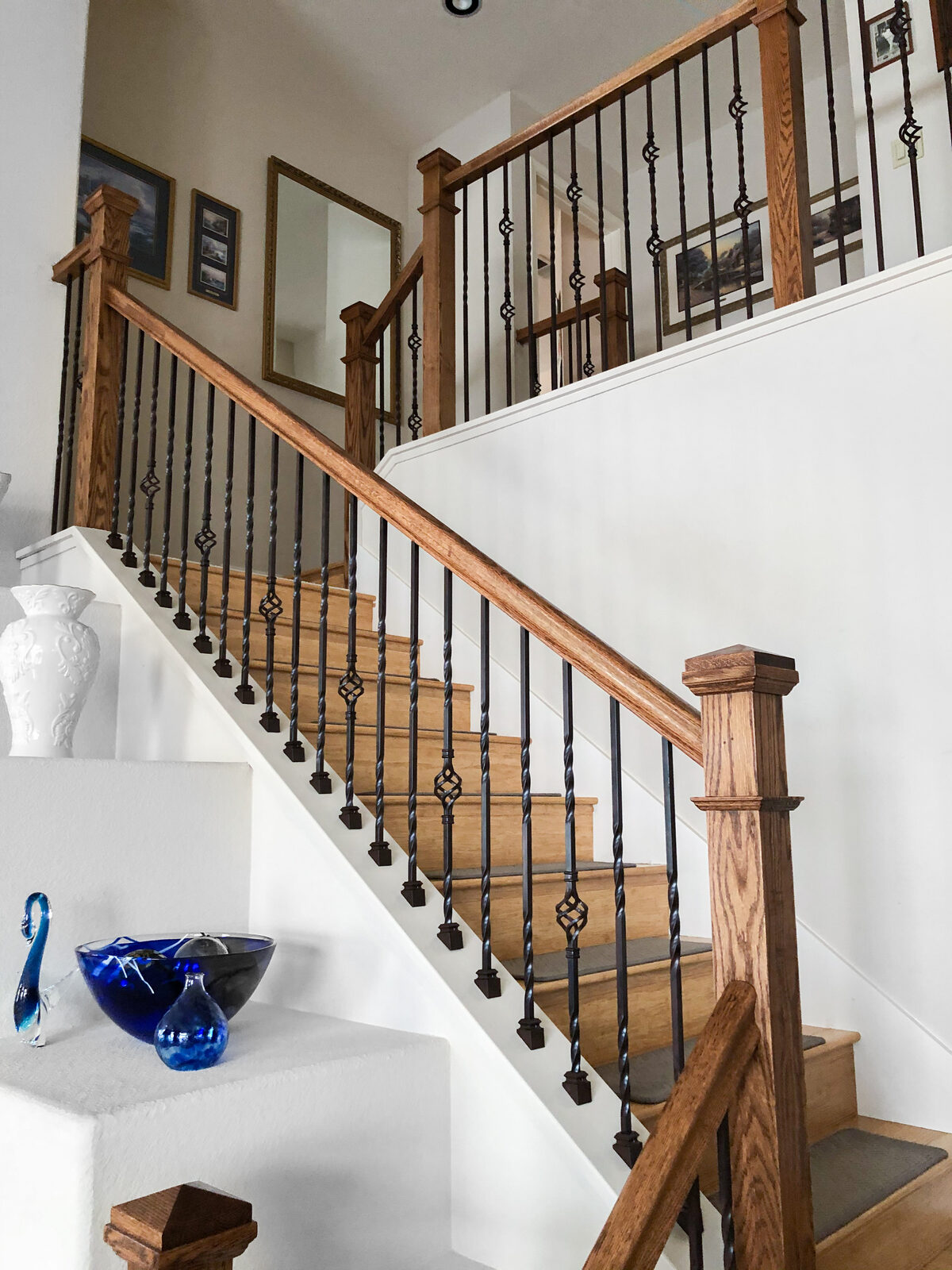 Curved staircase with white balusters and wood handrail, Folsom CA