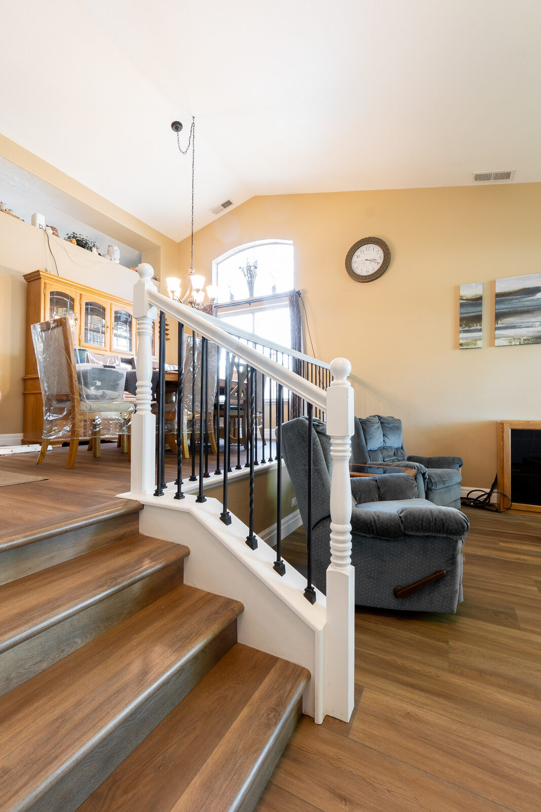 Iron baluster guardrail overlooking open living room, Roseville CA