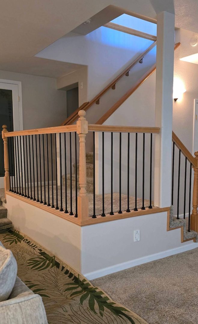 New wrought-iron balusters paired with the original stained wood railing — Alamo Stairs baluster upgrade, Northern California