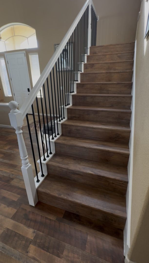 New wrought-iron balusters and refinished handrails for a like-new staircase — Roseville and Sacramento area