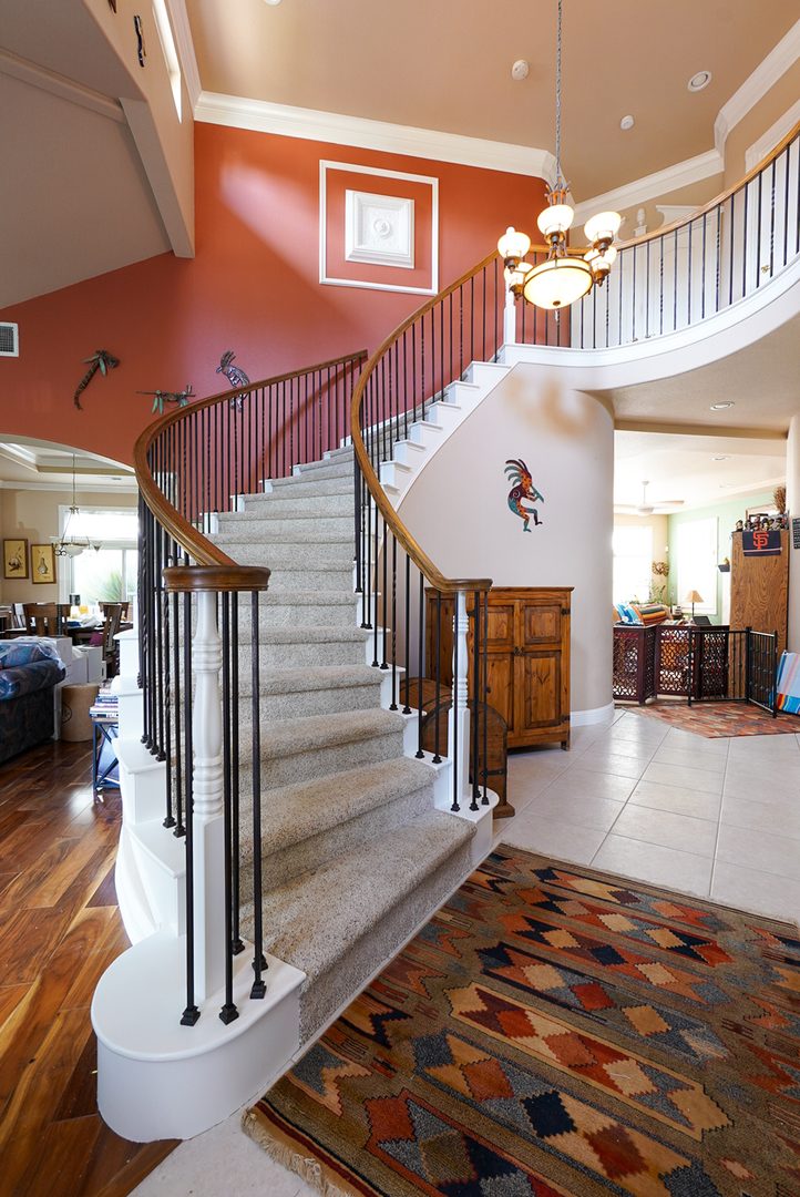Refinished staircase railing and posts paired with new black wrought-iron balusters — Alamo Stairs, Northern California
