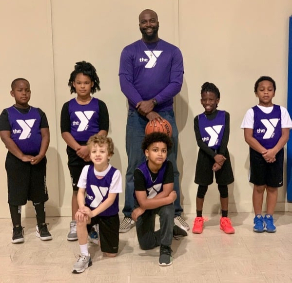 Kendrick coaching youth basketball and football — Coaching Builds Leaders