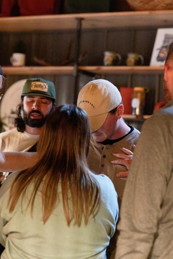 Hands laid on someone in prayer