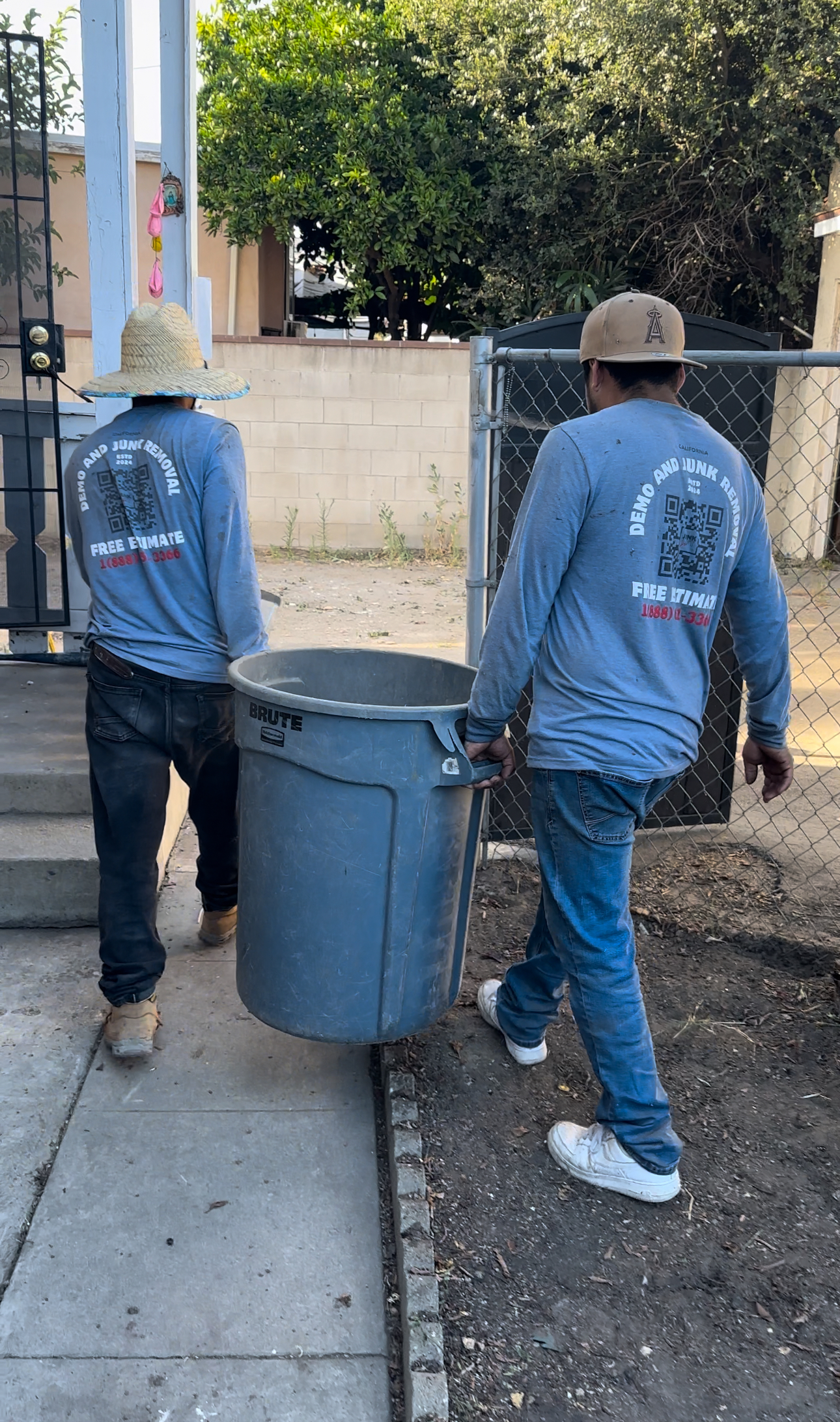 Founder portrait at a cleared worksite wearing hard hat and high-visibility vest